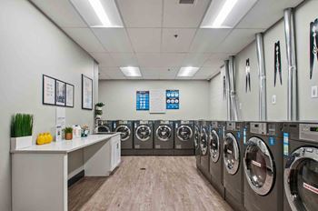 On-site laundry facilities with payrange app-based washers and dryers. Lease today for your first wash free!